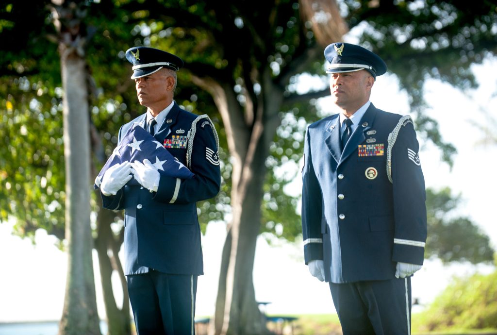 Tech. Sgt. Mark Crabbe and Staff Sgt. Darrell Bactad, 204th Airlift Squadron information managers, practice Honor Guard ceremonial movements Oct. 4, 2019, at Joint Base Pearl Harbor-Hickam, Hawaii. The two friends have performed military ceremonies side-by-side in the Hawaii Air National Guard Honor Guard team since the early 2000s. Crabbe became an honor guardsmen in 2001 and Bactad joined in 1999, when the unit was established. (U.S. Air National Guard photo by Senior Airman John Linzmeier)