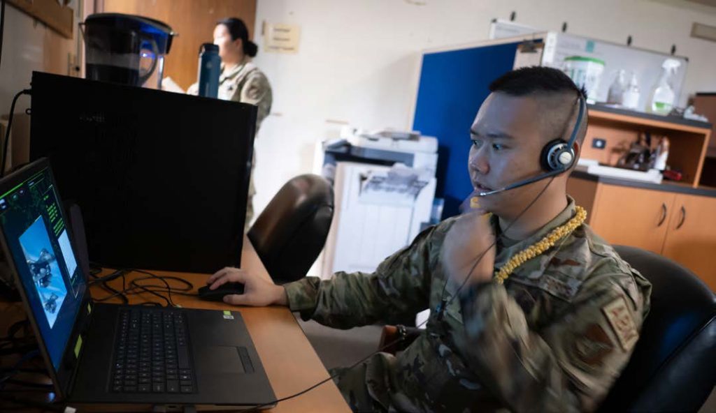 1s Lt. Sheldon Lee, 169th Air Defense Squadron air battle manager, operates an electronic training system Oct. 1, 2022, at Wheeler Army Air Field, Hawaii. Lee was named the overall champion of a career-field-wide training competition utilizing an artificial intelligence-based training platform. The platform, called Battle Management Training NEXT, simulates the activities of an air-to-air engagement and serves as a costeffective means for users to develop their command-and-control competencies. (U.S. Air National Guard photo by Staff Sgt. John Linzmeier