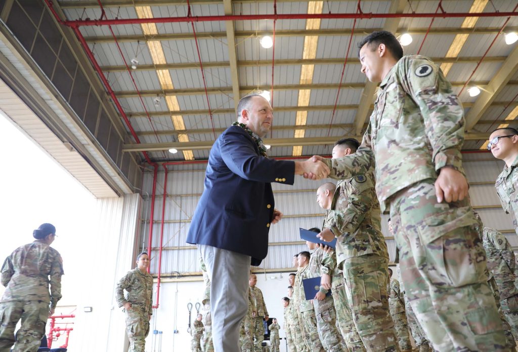 Hawai’i Army National Guard (HIARNG) Soldiers from the 189th Aviation Regiment and 126th MEDEVAC receive special recognition from the Honorable Governor Josh Green, M.D. and Maj. Gen. Kenneth S. Hara, the Adjutant General at Wahiawa, Hawai’i, Feb. 4, 2023. Over 25 military personnel including flight crew, additional support staff, aircraft maintenance, re-fueling personnel, and paramedics were recognized for conducting over 14 flights, saved 14 lives, and logged a total 30.1 flight hours, covering the zones from Kauai, Molokai, Maui, Oahu and to Big Island. For the first time in history, U.S. Army National Guard flight paramedics and civilian flight paramedics joined forces treating patients together in the back of a UH-60 Blackhawk helicopters. (U.S. Army National Guard photo by Sgt. Justin Nye)