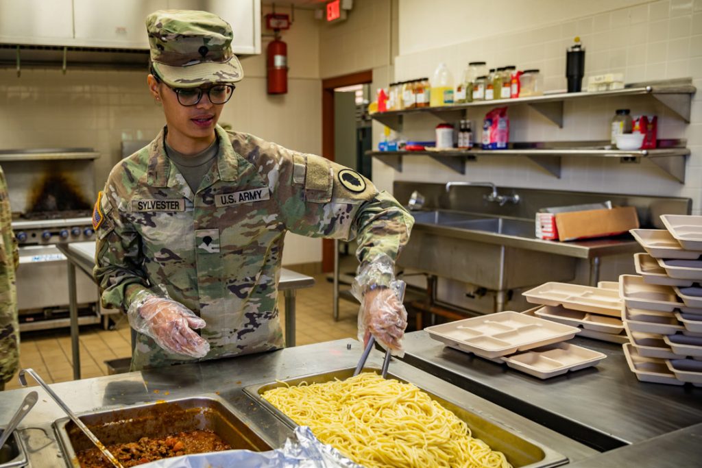 U.S. Army Spc. Shalin Sylvester, a culinary specialist assigned to the 50th Quartermaster Detachment (50 QM), 103rd Troop Command, Hawai‘i Army National Guard, serves lunch at Waiawa Armory, Pearl City, Hawai‘i, Feb. 3, 2024. The mission of the 50 QM is to provide field feeding support for up to 700 personnel at the Echelons Above Brigade level as well as provide National Guard Civil Support throughout Hawaii. (U.S. Army National Guard photo by Sgt. Lianne M. Hirano)