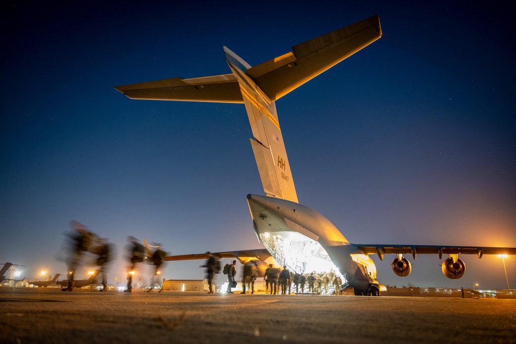 U.S. Army Soldiers assigned to the 2nd Infantry Brigade Combat Team (Airborne), 11th Airborne Division exit a C-17 Globemaster III during Joint Pacific Multinational Readiness Center 24-1 at March Air Reserve Base Oct. 28, 2023. The JPMRC is the Army’s newest Combat Training Center (CTC) and generates readiness in the environments and conditions where our forces are most likely to operate in. JPMRC 24-1 includes over 5,300 training participants from across the U.S. Joint Force, New Zealand, the United Kingdom, Indonesia, and Thailand. (U.S. Air National Guard photo by Master Sgt. Mysti Bicoy