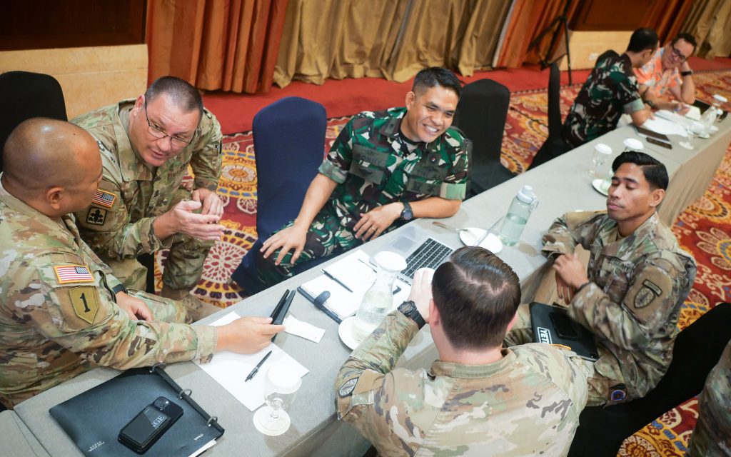 Hawai‘i Army National Guard State Partnership Program medical representatives Maj. Ryan Ruiz and 1st Sgt. Aaron Pitts, hold a medical working group with Tentara Nasional Indonesia Lt. Cdr. Ronny Basirun Simatupang, Indonesia Armed Forces Surgeon General Headquarters staff officer and emergency nurse, and other joint partners May 6, at Jakarta Indonesia. The two nations gathered to continue Bilateral Defense Discussions to develop mutual training initiatives for an ongoing series of multinational training events. This Mid-Term Review aimed to build upon foundational initiatives from the previous gathering in December 2023, by assessing the progress of defense goals across a multitude of warfighting and emergency-response competencies. (U.S. Air Force photo by Tech. Sgt. John Linzmeier)