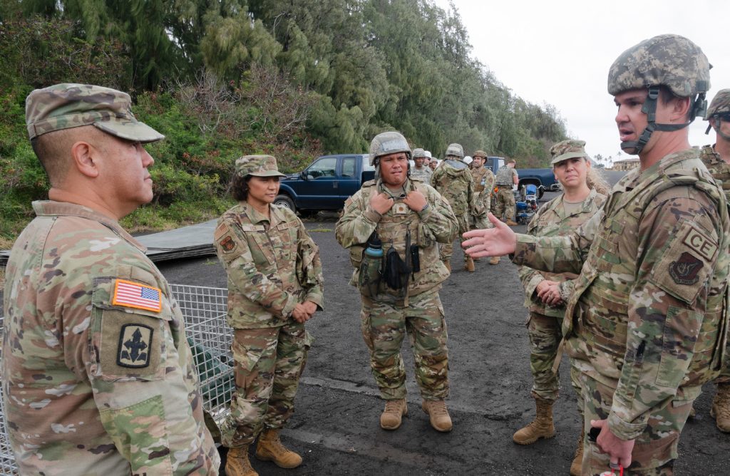 Hawai‘i Air National Guard Lt. Col. Christopher J. Mayor, commander of the 154th Civil Engineer Squadron, describes the Multi-Capable Airman concept to the Adjutant General, Maj. Gen. Kenneth S. Hara, during Pacific Warriorz 2024 exercise at Bellows Air Force Station, Waimanalo, Hawai‘i April 7, 2024. The primary objective of the exercise was to conduct movement, beddown and base recovery efforts after a simulated airfield attack. The competencies applied throughout the training event developed multi-capable Airmen, improved readiness, and strengthened partnerships among active, guard and reserve partners. (Air National Guard photo by Staff Sgt. Robert J. Cabuco)