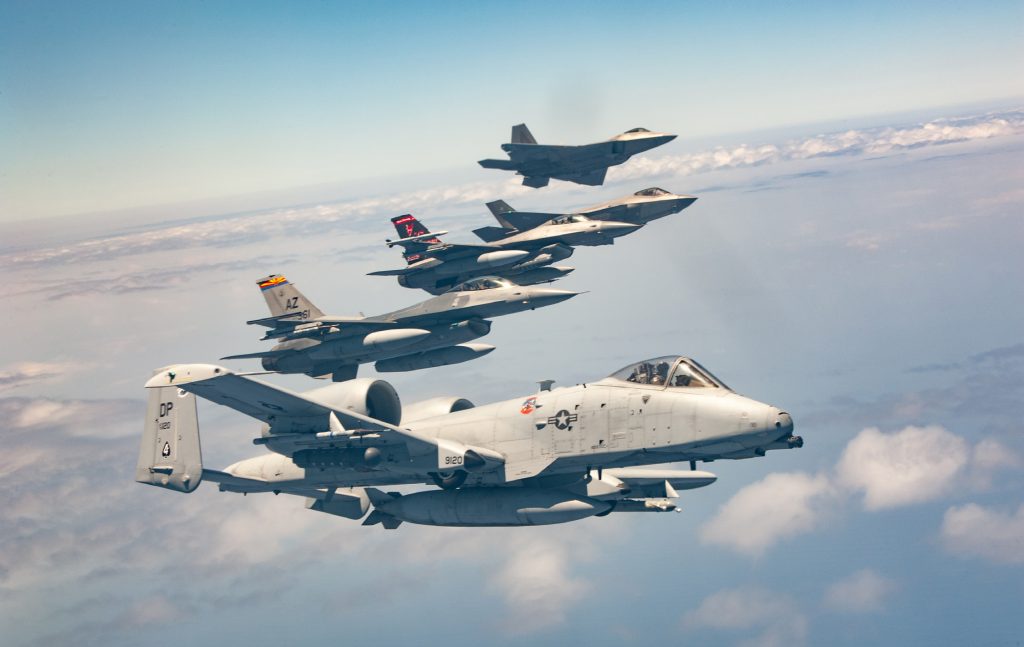 A formation of U.S. Air Force aircraft, including an A-10 Warthog and F-16 Fighting Falcon from the Air National Guard Air Force Reserve Test Center, an F-16 from the 177th Fighter Wing, an F-35A Lighting II from the 422nd Test and Evaluation Squadron, and an F-22 Raptor, operated by the 199th and 19th Fighter Squadrons, assemble during exercise Sentry Aloha 24-2 June 6, 2024, above the island of Hawai‘i. This iteration of the exercise involves approximately 1,060 participants and more than 40 aircraft from nine states, which operated out of Joint Base Pearl Harbor-Hickam, Marine Corps Base Hawai‘i, and Onizuka Kona International Airport, Keāhole. The Hawai‘i Air National Guard’s 154th Wing has hosted the exercise for more than 20 years to provide tailored, cost-effective and realistic combat training for total-force Airmen and other Department of Defense services. (U.S. Air National Guard photo by Tech. Sgt. John Linzmeier)