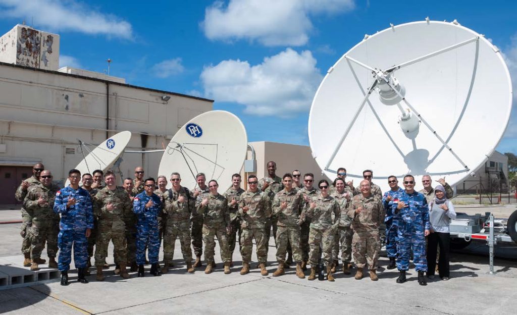 Participants of the Vulcan Guard Bolt-7 Space Subject Matter Expert Exchange receive a tour of the 109th Electromagnetic Warfare Squadron during the first Vulcan Guard Bolt-7 Space Subject Matter Expert Exchange on Sept. 16, 2024, at Joint Base Pearl Harbor-Hickam, Hawai‘i. The Hawai‘i Air National Guard hosted this multinational event to foster collaboration and enhance space capabilities. Participants explored cutting-edge space defense systems crucial to the protection of both military and civilian assets. (U.S. Air National Guard photo by Tech. Sgt. John Linzmeier)