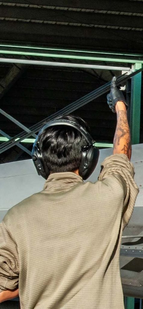 U.S. Air Force Senior Airman Feilanie Felicitas, 154th Aircraft Maintenance Squadron, tactical aircraft mechanic, signals for all clear to a U.S. Air Force F-22 Raptor assigned to the 199th and 19th Fighter Squadrons at Joint Base Pearl Harbor-Hickam, Hawaii, on Feb. 11. 2025, during Sentry Aloha 25-1. Fighter jets, tankers, and support units participated in simulated combat scenarios, enhancing interoperability and readiness among U.S. military forces. (U.S. Air National Guard photo by Senior Airman Roann Gatdula