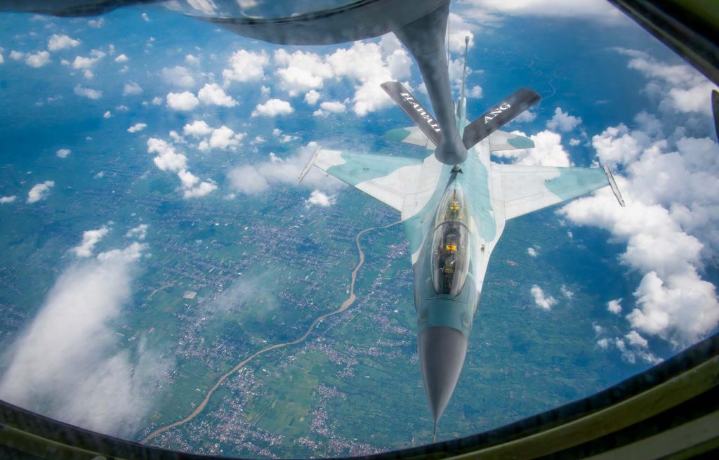 An Indonesian Air Force (IDAF) F-16 Fighting Falcon flies alongside a Hawai‘i Air National Guard KC-135 Stratotanker assigned to the 203rd Air Refueling Squadron during an air-to-air refueling training mission over Indonesia, on Feb. 19, 2025. This bilateral training, supported by the 154th Wing, enables IDAF pilots to recertify their F-16 air refueling qualifications while strengthening interoperability and regional security. The Hawai‘i National Guard State Partnership Program continues to enhance operational readiness and fosters U.S.-Indonesia defense cooperation in support of a free and open Indo-Pacific. (U.S. Air National Guard photo by Master Sgt. Mysti Bicoy