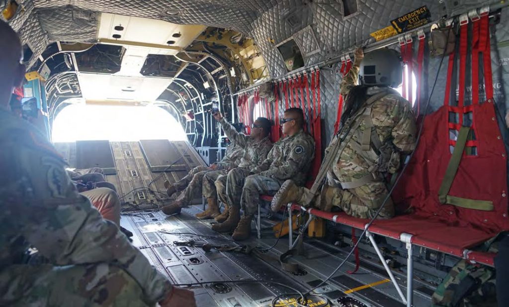 Guardsmen admire the view outside the 47F Chinook Helicopter as it flys over Upcountry Maui. (Photo by Rachel Blaire)