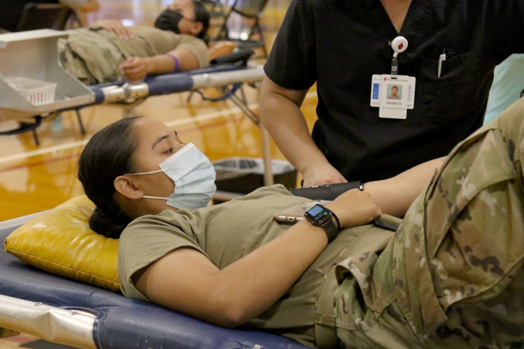 Hawaii Army National Guard Soldier Spc. Jovoni Shimabukuro, a Culinary Specialist with the 1109th Theater Aviation Sustainment Maintenance Group, has her blood pressure checked before donating on June 12, 2021. This was the first annual event co-organized by the Hawai‘i Army National Guard, the Hawaii Building & Construction Trades Council and the Blood Bank of Hawaii. (U.S. Army National Guard photo by Spc. Mariah-Alexsandra Manandic-Kapu)