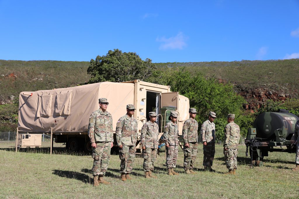 Hawai‘i Army National Guard soldiers assigned to Bravo Company, 1109th Theater complete inspection outside their cooking station during the Philip A. Connelly competition in Pearl City, Hawaii, June 3, 2022. Soldiers were timed while setting up the cooking and sanitization station. The competition includes all aspects of food preparation, safe execution and sanitation. (U.S. Army National Guard photo by Spc. Bethany Cravalho)