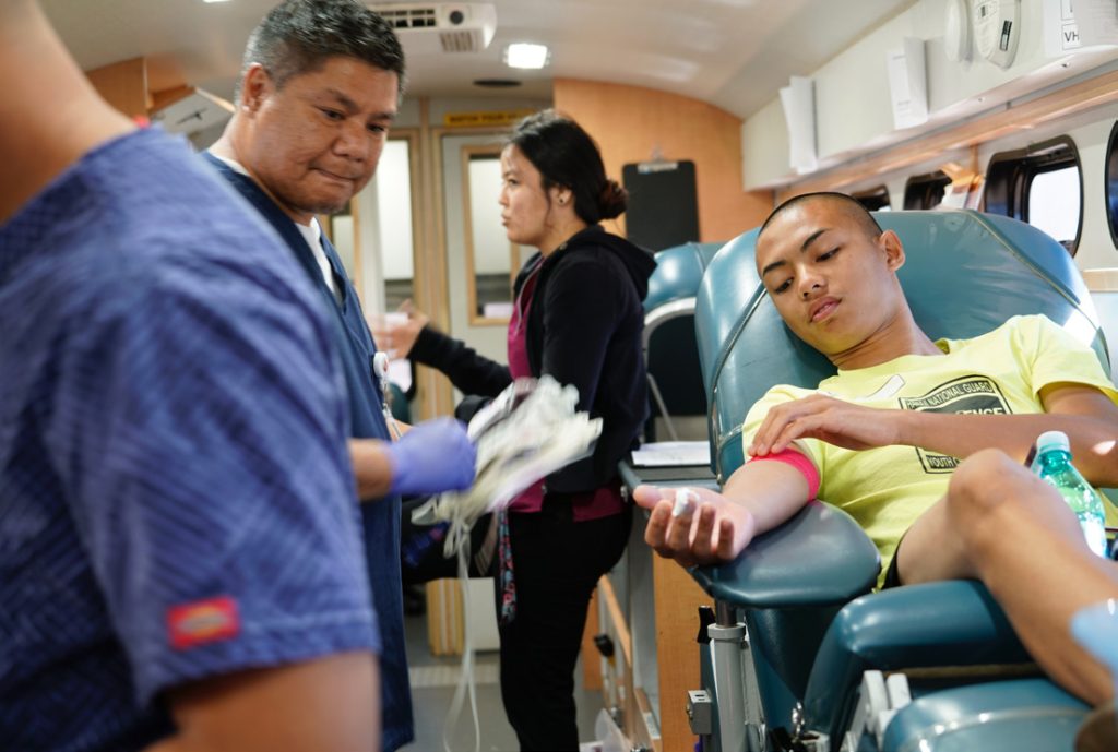 A Youth Challenge Academy Cadet rests during a donation of a blood drive for the Blood Bank of Hawaii, March 15, 2019. The Hawaii Youth Challenge Academy holds two cycle blood drives a year accounting for around 100 units donated annually. The donations also earn each Cadet credit towards their mandatory community service hours in the program. (U.S. Air National Guard Photo by Tech. Sgt. Andrew Jackson)