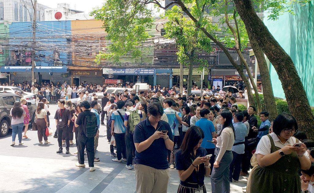 People evacuated into the streets of Asok, a central business district in Bangkok where Bactad’s hotel was located, waiting on word from authorities to safely return. (Photo by Master Sgt. (Ret) Darrell Bactad)