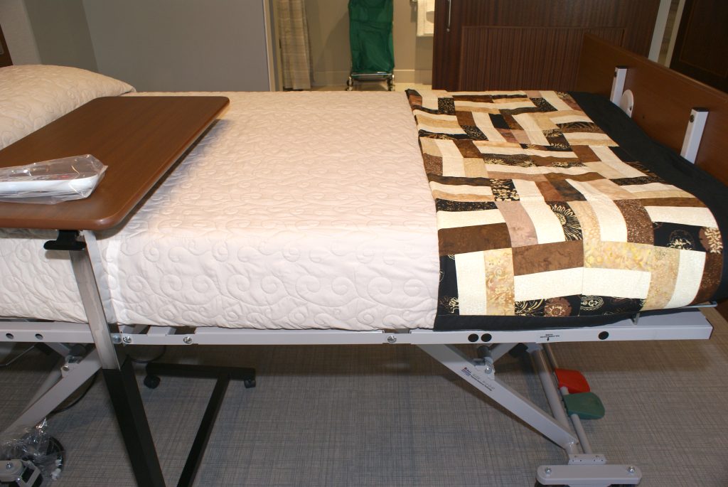A handmade lap quilt seen placed on a bed at the Daniel Kahikina Akaka State Veterans Home in Kapolei. (Jayme Nagamine photo)