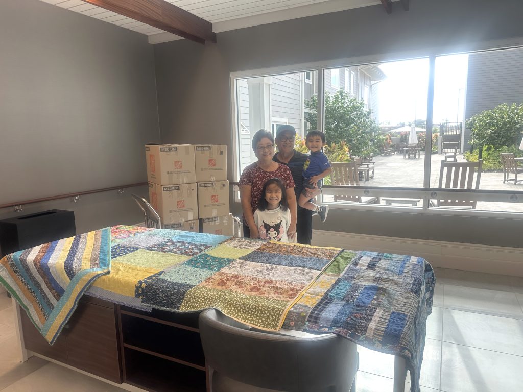 Wayne and Evelyn Kajiwara show some of their handmade lap quilts at the Daniel Kahikina Akaka State Veterans Home in Kapolei. They provided 120 quilts for the veterans who stay at the new facility. (Daniel Kahikina Akaka State Veterans Home photo)