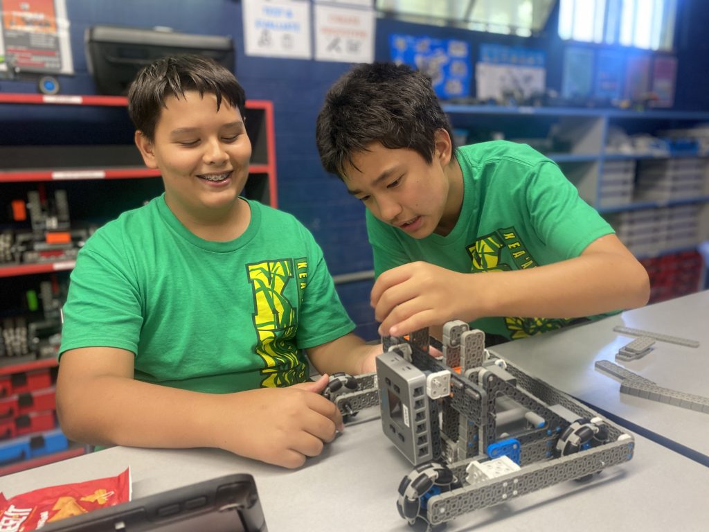STARBASE Hawai‘i/Kea‘au Robotics Team 5432B Team Captain Charlie Ahuna, left, and Aiden Kinoshita adjust their robot at the STARBASE Hawai‘i Robotics Lab. (Ken Smith photo)