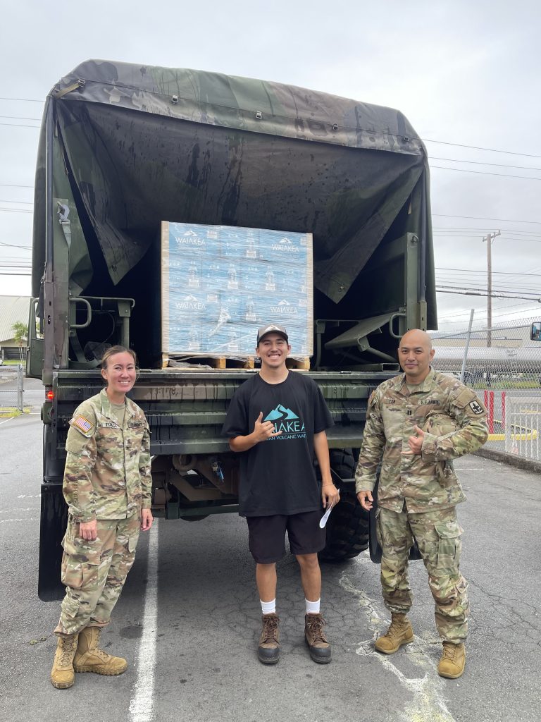 Geoli Ng is the Executive Director of the Kōkua Initiative at Waiākea Hawaiian Volcanic Water and was nominated for the Patriot Award, which celebrates supervisors who provide outstanding support to National Guard personnel. At left, Waiākea Hawaiian Volcanic Water employee Jaysen Bragado with Staff Sgt. Nellie Towata, left, and Capt. Kevin Tam pose for a photo after loading the last pallet of water for distribution. (Geoli Ng photos)