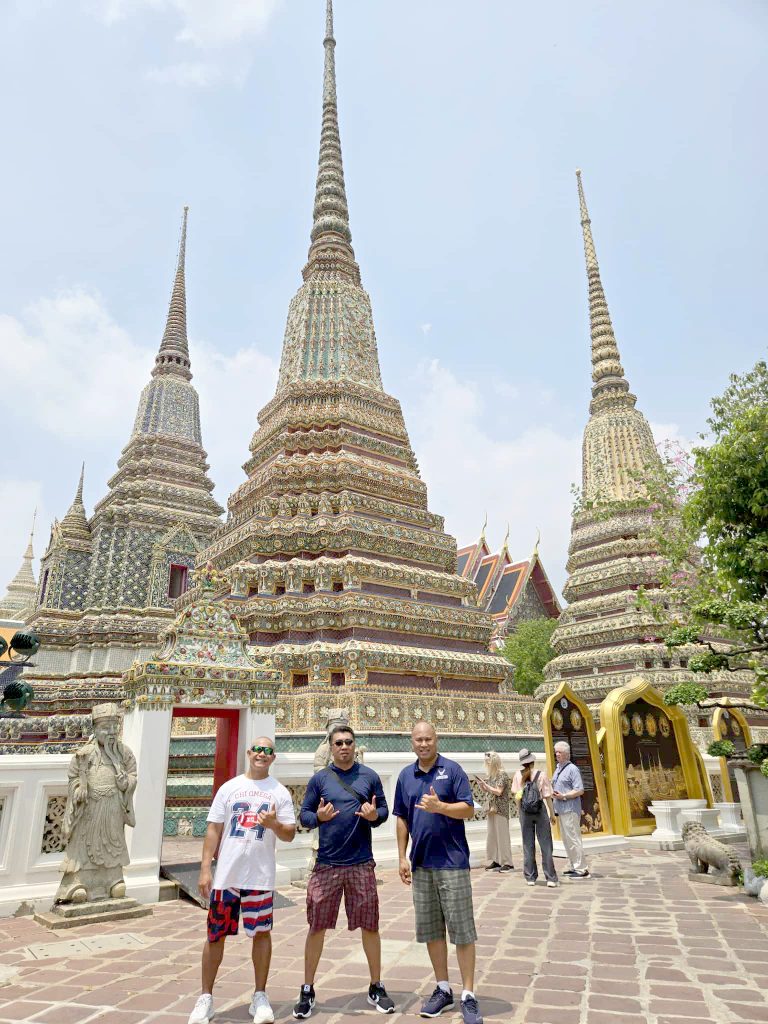 Master Sgt. (Ret) Darrell Bactad, right, pose for a photo with friends at Wat Po, a buddhist temple complex in the Phra Nakhon District in Bangkok, Thailand before the March 28 earthquake in the city. (Photo by Master Sgt. (Ret) Darrell Bactad))