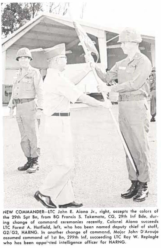 NEW COMMANDER-LTC John E. Aiona Jr., right, accepts the colors of the 29th Spt Bn, from BG Fronds S. Takemoto, CG, 29th Inf Bde, during change of command ceremonies recently. Colonel Aiona succeeds LTC Forest A. Hatfield, left, who has been named deputy chief of staff, G2/ G3, HARNG. In another change of command, Major John D'Araujo assumed command of 1st Bn, 299th Inf, succeeding LTC Roy W. Replogle who has been appointed intelligence officer for HARNG.