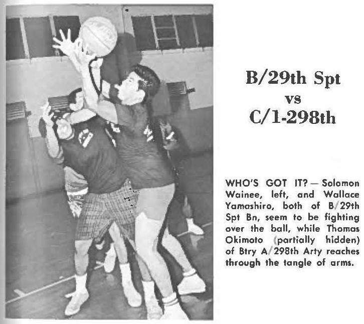 B/29th Spt vs C/l-298th WHO'S GOT IT? - Solomon Wainee, left, and Wallace Yamashiro, both of B/ 29th Spt Bn, seem to be fighting over the ball, while Thomas Okimoto (partially hidden) of Btry A/ 298th Arty reaches through the tangle of ams.