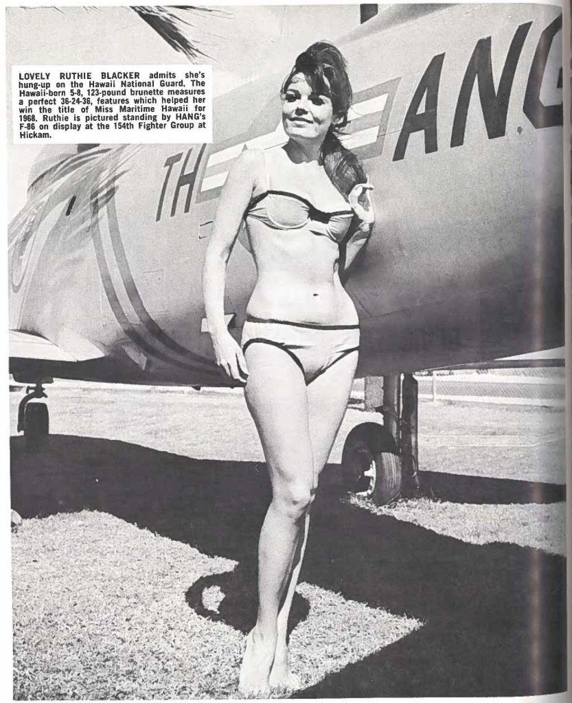 LOVELY RUTHIE BLACKER admits she's hung-up on the Hawaii National Guard. The Hawaii-born 5-8, 123-pound brunette measures a perfect 36-24-36, features which helped her win the title of Miss Maritime Hawaii for 1968. Ruthie is pictured standing by HANG's F-86 on display at the 154th Fighter Group at Hickam.