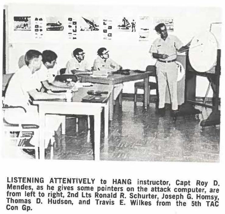 LISTENING ATTENTIVELY to HANG instructor Capt Roy D Mendes, as he gives some pointers on the attack computer, are from left to right, 2nd Lts Ronald R. Schurter, Joseph G. Homsy, Thomas D. Hudson, and Travis E. Wilkes from the 5th TAC Con Gp.