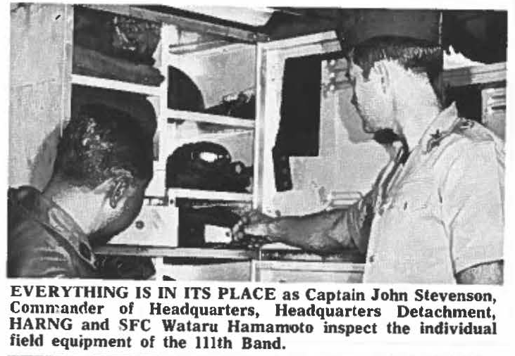 EVERYTHING IS IN ITS PLACE as Captain John Stevenson, Commander of Headquarters, Headquarters Detachment, HARNG and SFC Wataru Hamamoto inspect the Individual field equipment of the 111th Band.