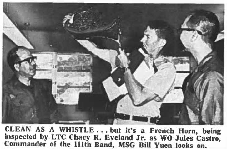 CLEAN AS A WHISTLE ... but it's a French Horn, being inspected by LTC Chacy R, Eveland Jr. as WO Jules Castro, Commander of the 111th Band, MSG Bill Yuen looks on.