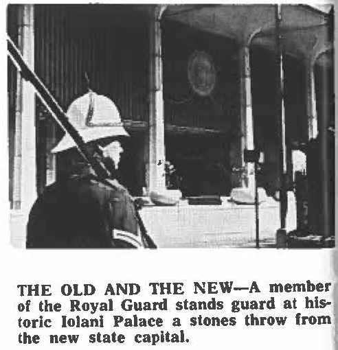 THE OLD AND THE NEW-A member of the Royal Guard stands guard at historic lolani Palace a stones throw from the new state capital.