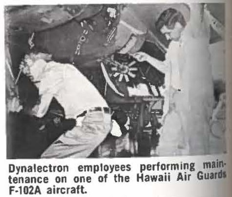 Dynalectron employees performing maintenance on one of the Hawaii Air Guards F-102A aircraft.