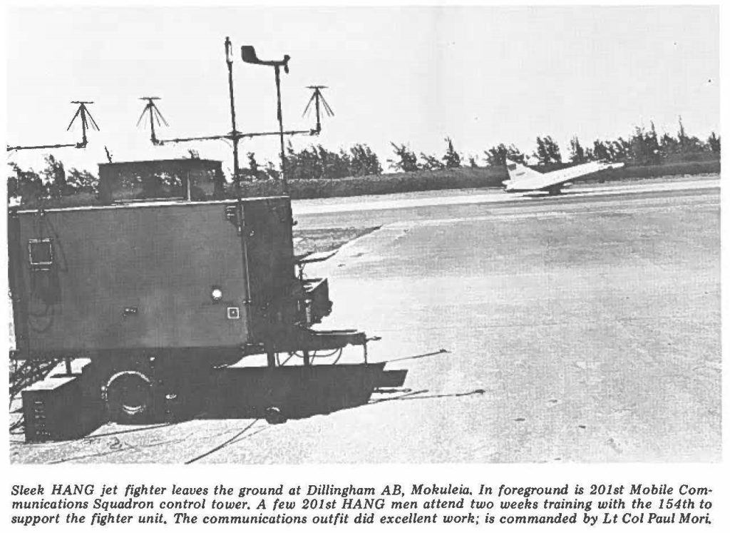 Sleek HANG jet fighter leaves the ground at Dillingham AB, Mokuleia. In foreground is 201st Mobile Communications Squadron control tower. A few 201st HANG men attend two weeks training with the 154th to support the fighter unit. The communications outfit did excellent work; is commanded by Lt Col Paul Mori