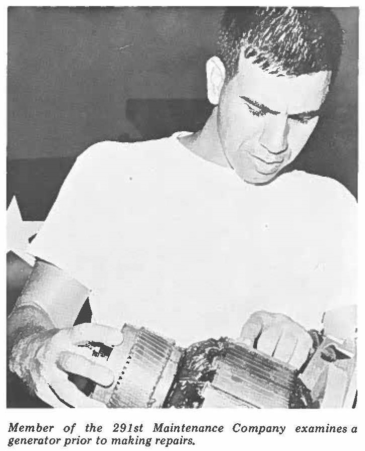 Member of the 291st Maintenance Company examines a generator prior to making repairs.