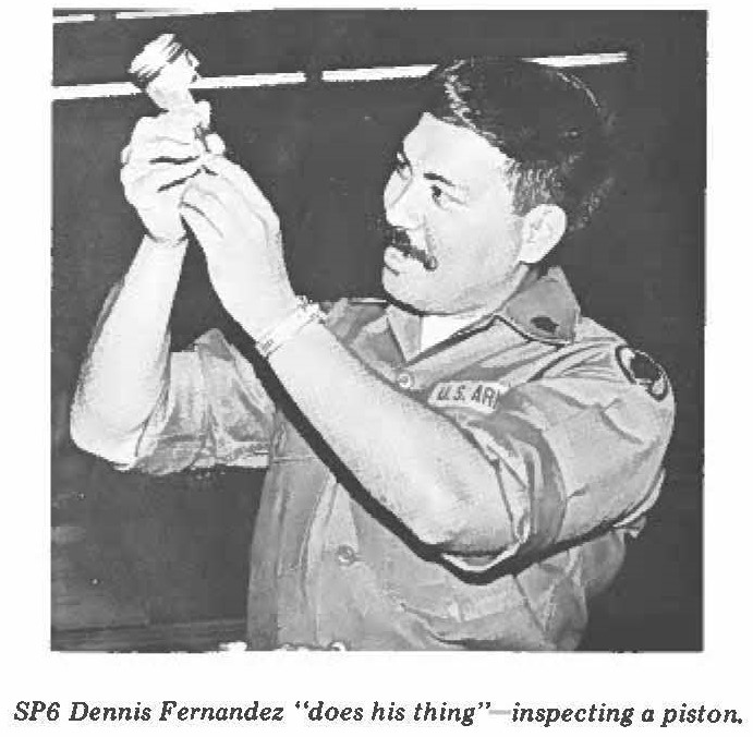 SP6 Dennis Fernandez "does his thing" inspecting a piston.