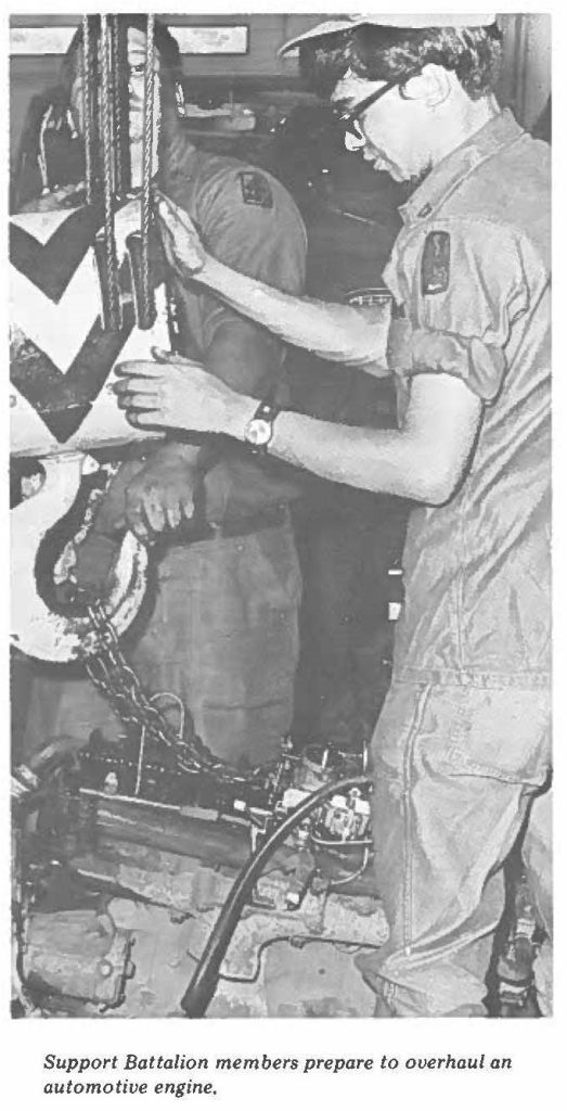 Support Battalion members prepare to overhaul an automotive engine.