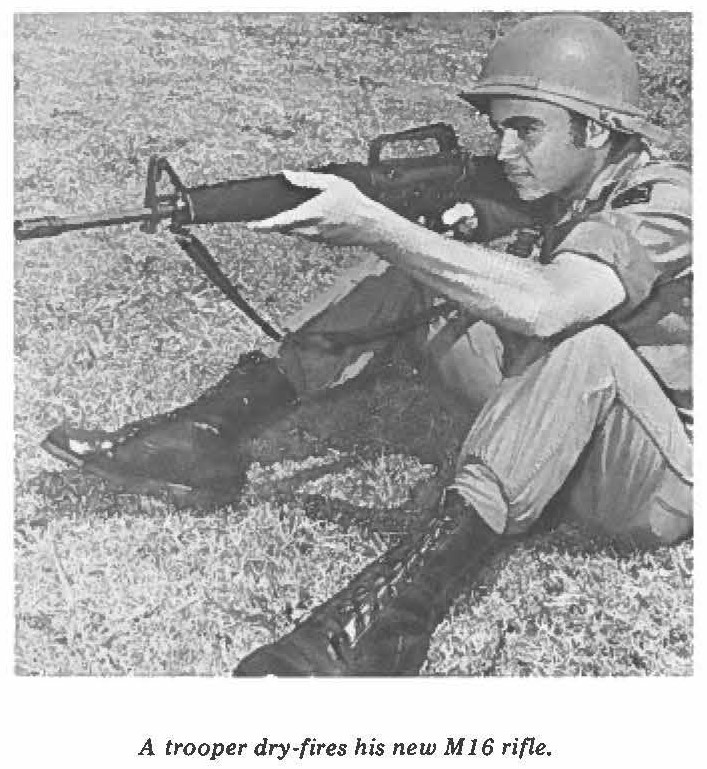 A trooper dry-fires his new M 16 rifle.