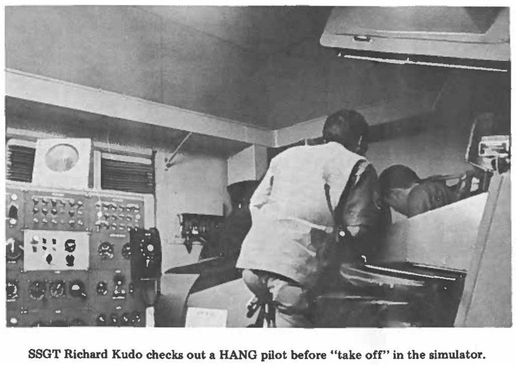SSGT Richard Kudo checks out a HANG pilot before "take off" in the simulator.