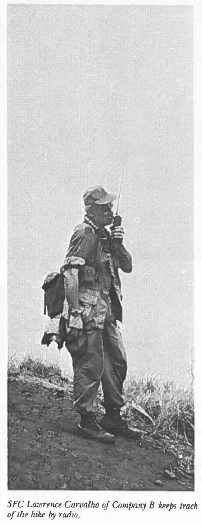 SFC Lawrence Carvalho of Company B keeps track of the hike by radio.