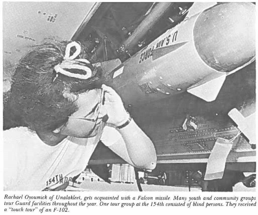 Rachael Oyoumick of Unalakleet, gets acquainted with a Falcon missile. Many youth and community groups tour Guard facilities throughout the year. One tour group at the 154th consisted of blind persons. They received a "touch tour" of an F-102.