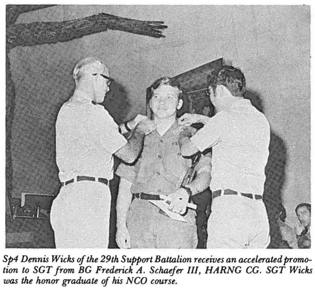 Sp4 Dennis Wicks of the 29th Support Battalion receives an accelerated promotion to SGT from BG Frederick A. Schaefer III, HARNG CG. SGT Wicks was the honor graduate of his NCO course.