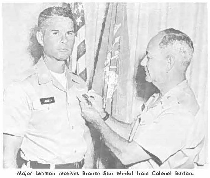 Major Lehman receives Bronze Star Medal from Colonel Burton.