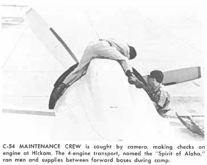 C-54 MAINTENANCE CREW is caught by camera, making checks on engine at Hickam. The 4-engine transport, named the "Spirit of Aloha," ran men and supplies between forward bases during camp.