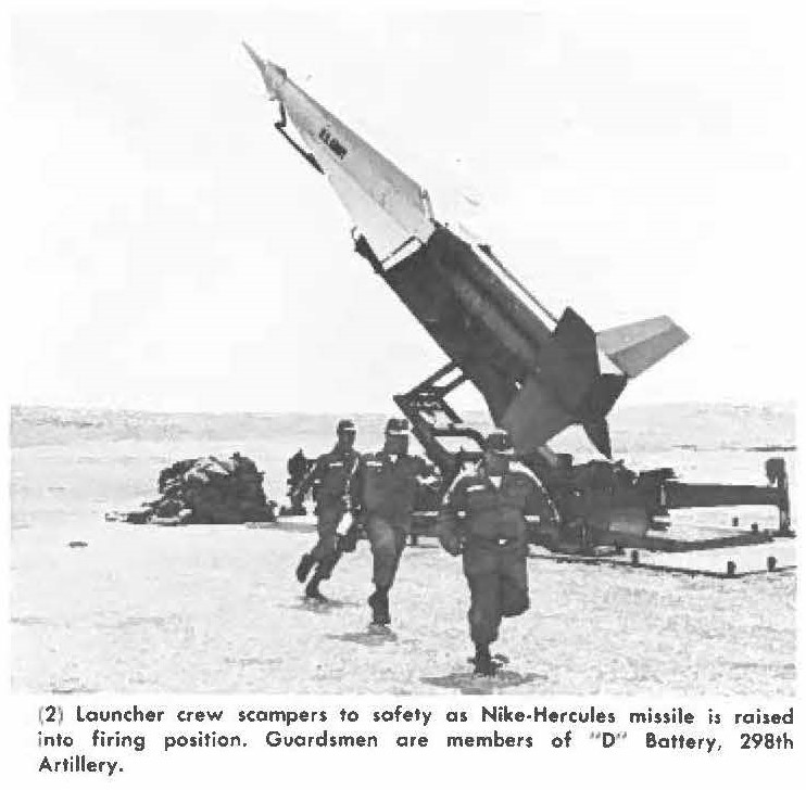 (2) launcher crew scampers to safety a, Nike-Hercules missile is raised into firing position. Guardsmen cue members of " D" Battery, 298th Artillery