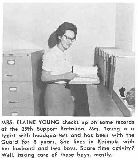 MRS. ELAINE YOUNG checks up on some records of the 29th Support Battalion. Mrs. Young is a typist with headquarters and has been with the Guard for 8 years. She lives in Koimuki with her husband and two boys. Spare time activity? Well, taking care of those boys, mostly,