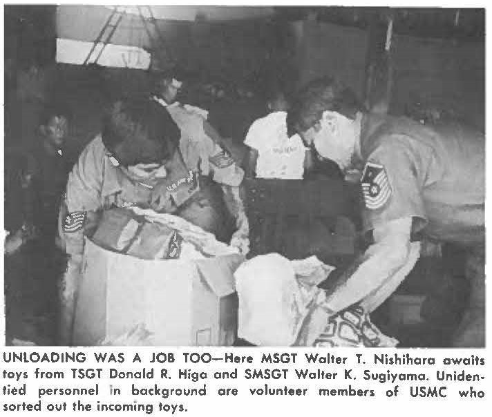 UNLOADING WAS A JOB TOO-Here MSGT Walter T. Nishihara awaits toys from TSGT Donald R. Higo and SMSGT Walter K. Sugiyama. Unidentied personnel in background are volunteer members of USMC who sorted out the incoming toys.