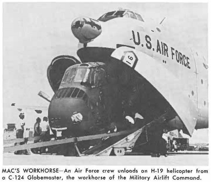 MAC'S WORKHORSE An Air Force crew unloads an H-19 helicopter from a C-124 Globemaster, the workhorse of the Military Airlift Command.