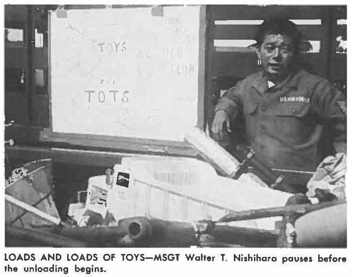 LOADS AND LOADS OF TOYS-MSGT Walter T. Nishihara pauses before the unloading begins.