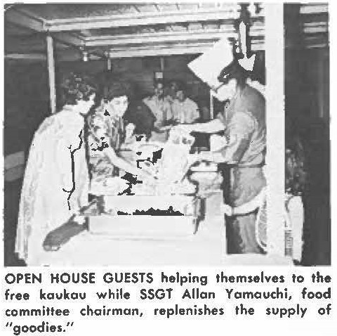 OPEN HOUSE GUESTS helping themselves to the free kaukou while SSGT Allon Yamauchi, food committee chairman, replenishes the supply of "goodies."