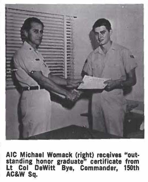 A1C Michael Womack (right) receives "outstanding honor graduate' certificate from Lt Col DeWitt Bye, Commander, 150th AC&W Sq.