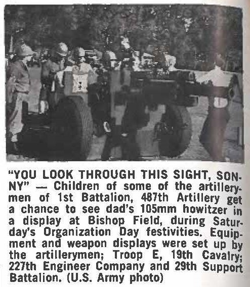 "YOU LOOK THROUGH THIS SIGHT, SONNY" - Children of some of the artillery men of 1st Battalion, 487th Artillery get a chance to see dad's 105mm howitzer in a display at Bishop Field, during Saturday's Organization Day festivities. Equipment and weapon displays were set up by the artillerymen; Troop E, 19th Cavalry; 227th Engineer Company and 29th Support Battalion. (U.S. Army photo)