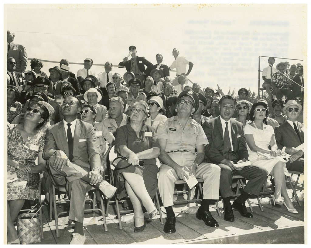WE776-2779/GP61 Schofield Barracks Spectators and dignitaries at Dillingham AFB watches as the first Nike Hercules missile to be fired on Oahu, Hawaii, leaves its launching pad for its target. The firing was done by members of the Hawaii Army National Guard, Btry C, 2nd Msl Bn, 298th Arty Gp (Air Defense) during the first annual Service Practices, at Dillingham AFB. 8 November 1961 Photo by PFC Ronald D Shook 125th Signal Battalion (Inf Div) APO 25