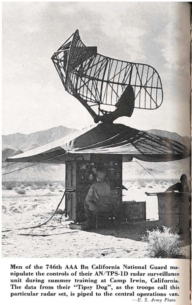 Men of the 746th AAA Bn California National Guard manipulate the controls of their AN/ TPS-ID radar surveillance unit during summer training at Camp Irwin, California. The data from their "Tipsy Dog", as the troops call this particular radar set, is piped to the central operations van.